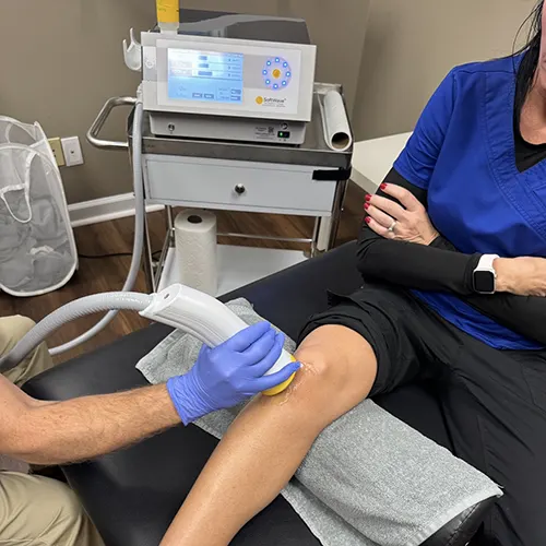 SoftWave Therapy being performed on a Patients Right Knee